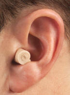 Rolled up earplug in ear